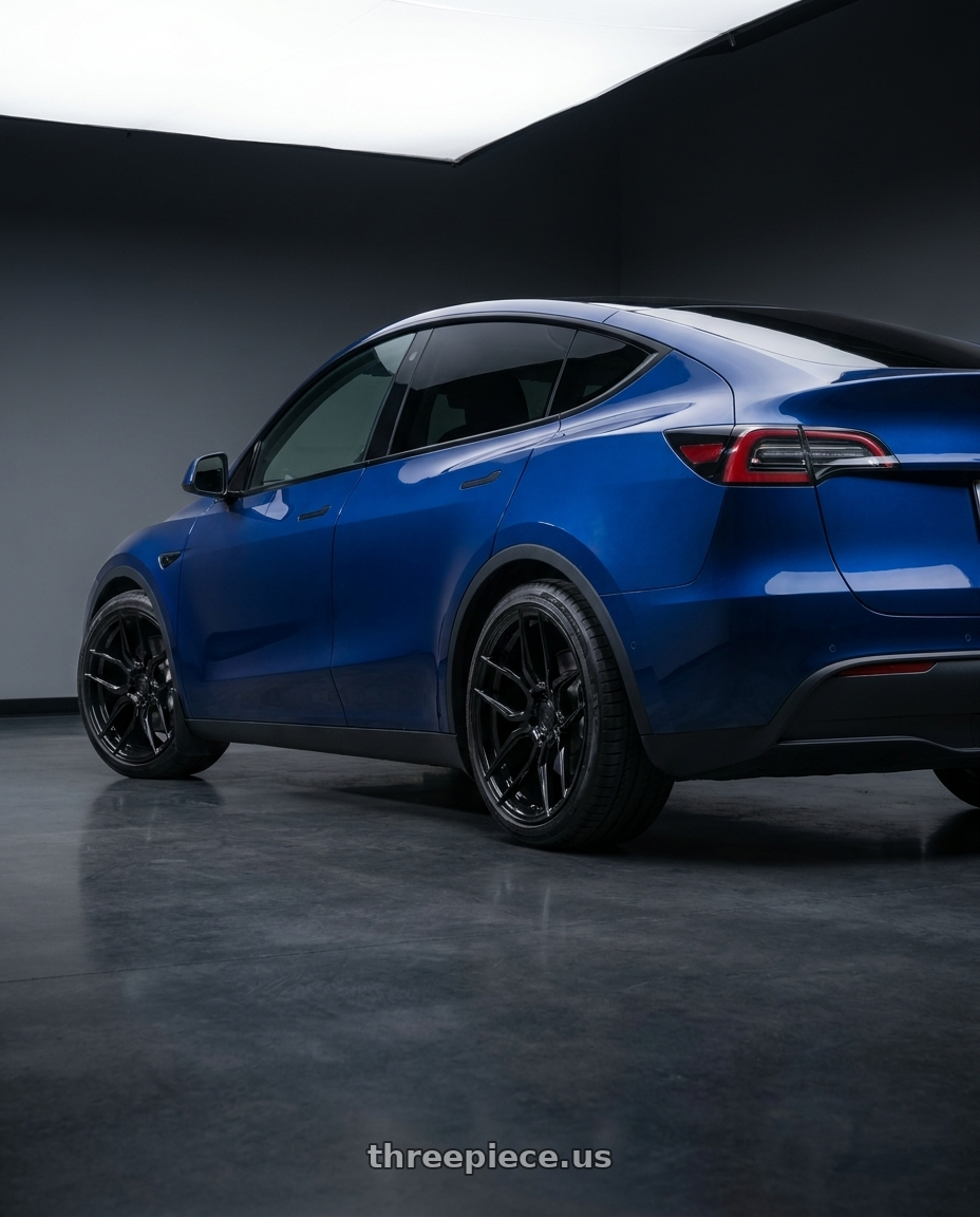 2023 Tesla Model Y with Rohana RFX7 5x112 21x11.5 +30 Gloss Black wheels rear three quarter view square tires