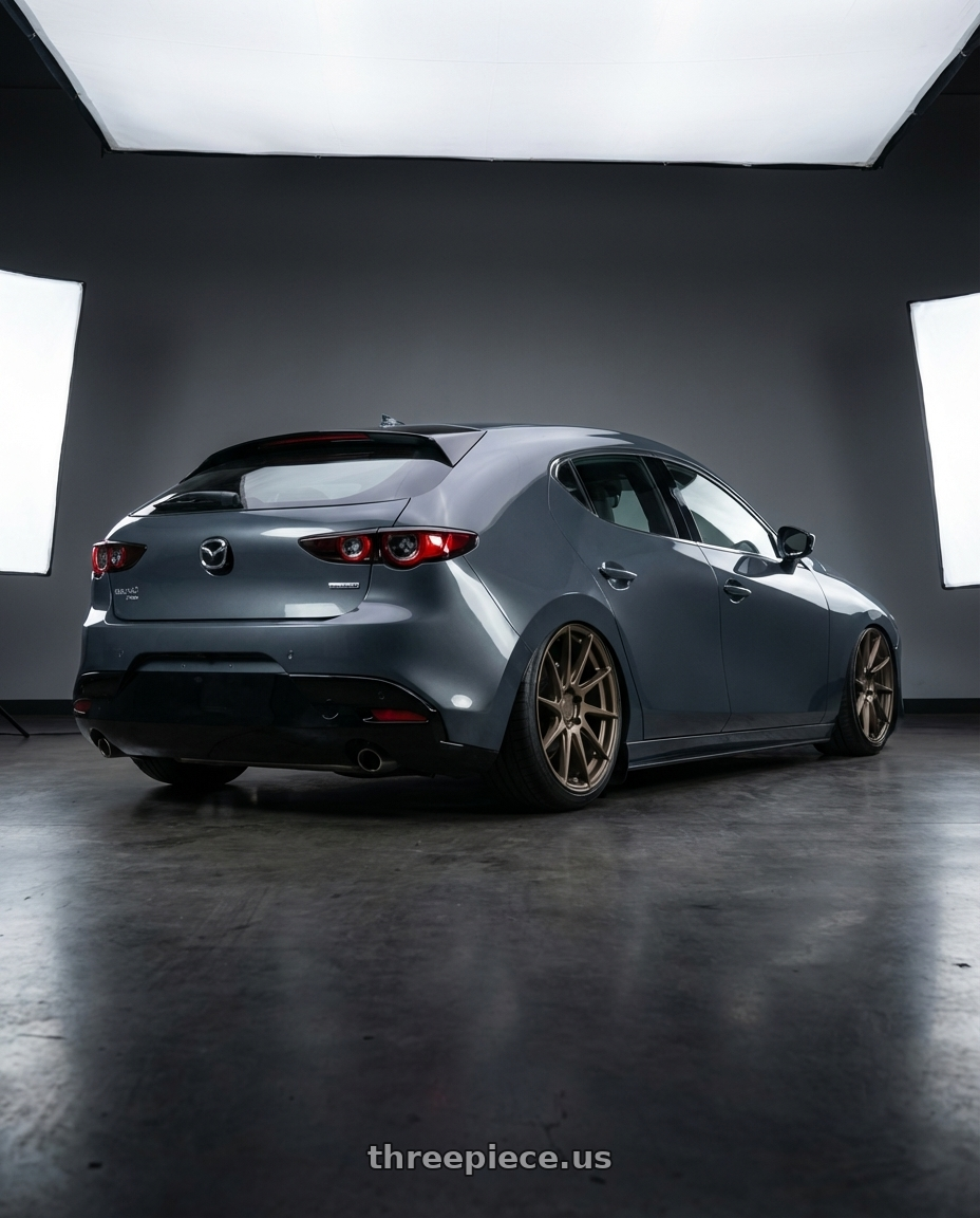 2023 Mazda Mazda3 Turbo with Aodhan AH09 5x114.3 18x8.5 +35 Matte Bronze wheels rear three quarter view slight stretch tires