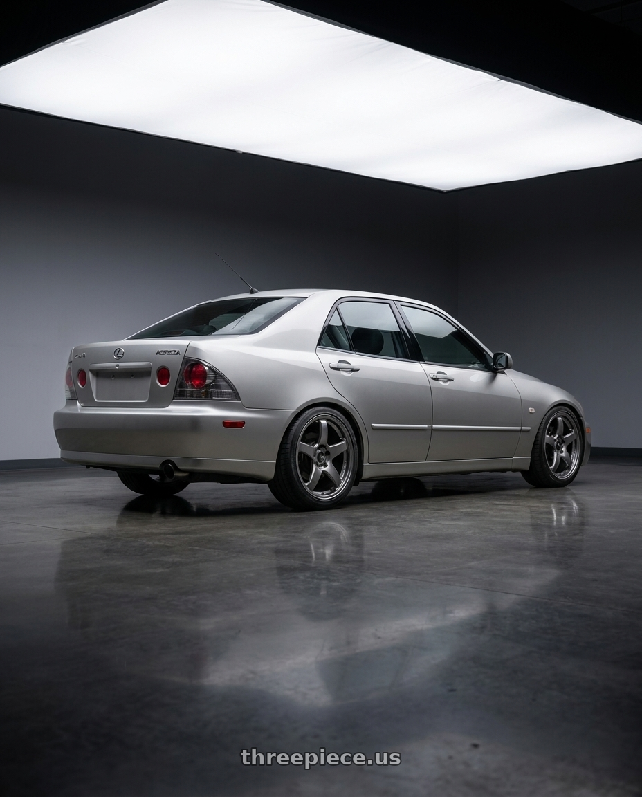 1999 Toyota altezza with Enkei PF05 5x114.3 17x8+35 Dark Silver wheels rear three quarter view square tires