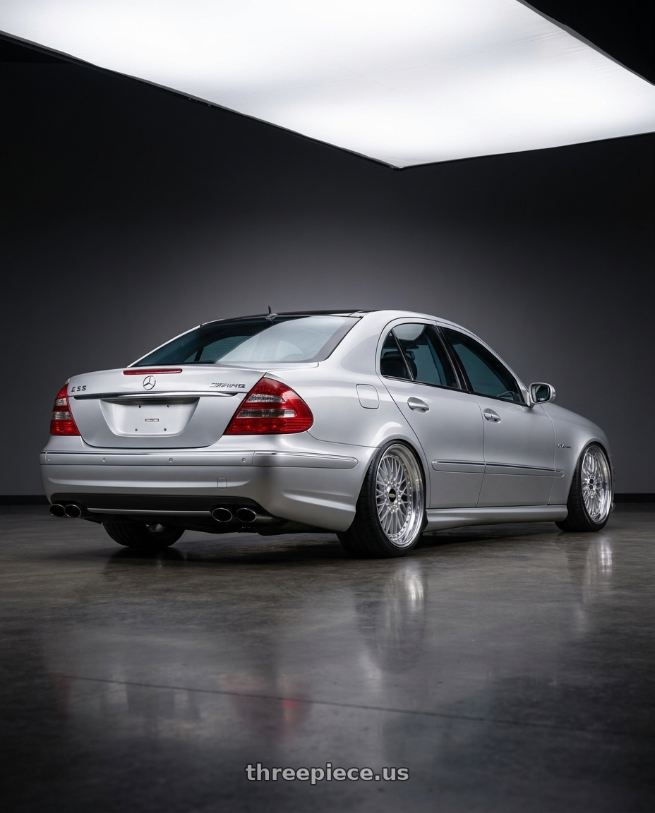 2006 Mercedes E55 AMG with BBS Super 5x112 19x10 +40 Diamond Silver wheels rear three quarter view extreme stretch tires