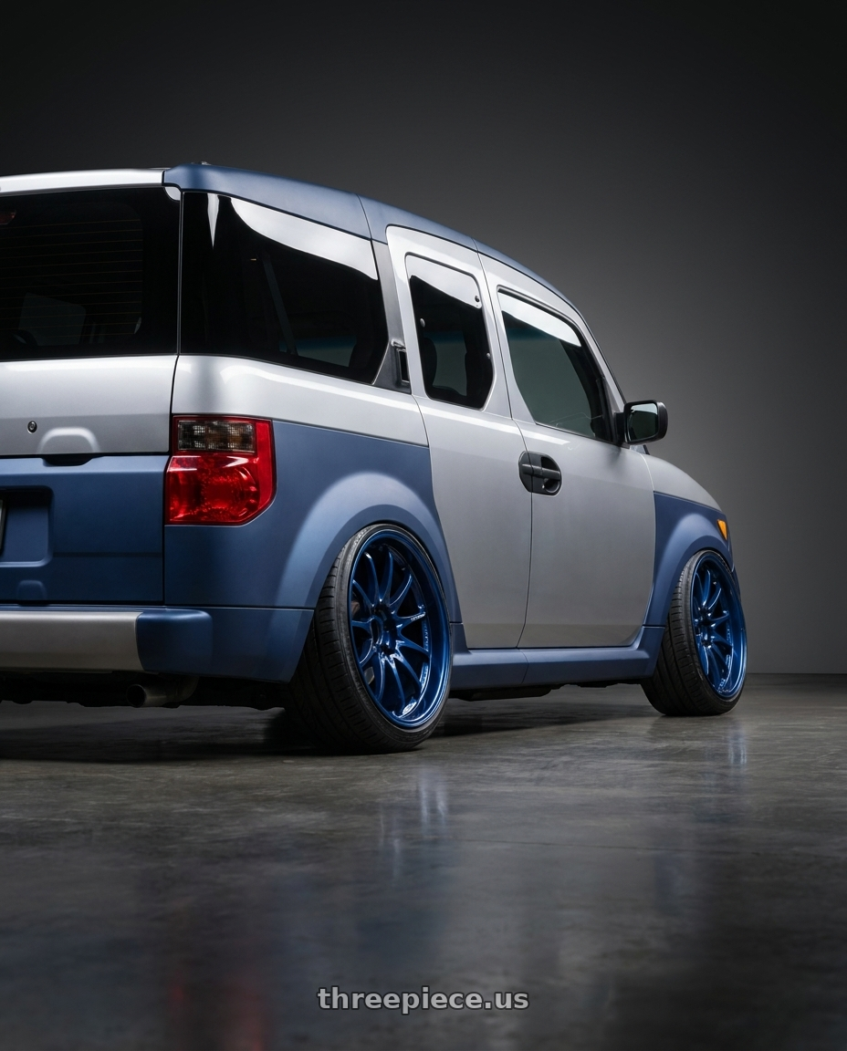 2006 Honda Element with Volk Racing CE28N-PLUS 5x114.3 18x10.5+15 Mag Blue wheels rear three quarter view extreme stretch tires