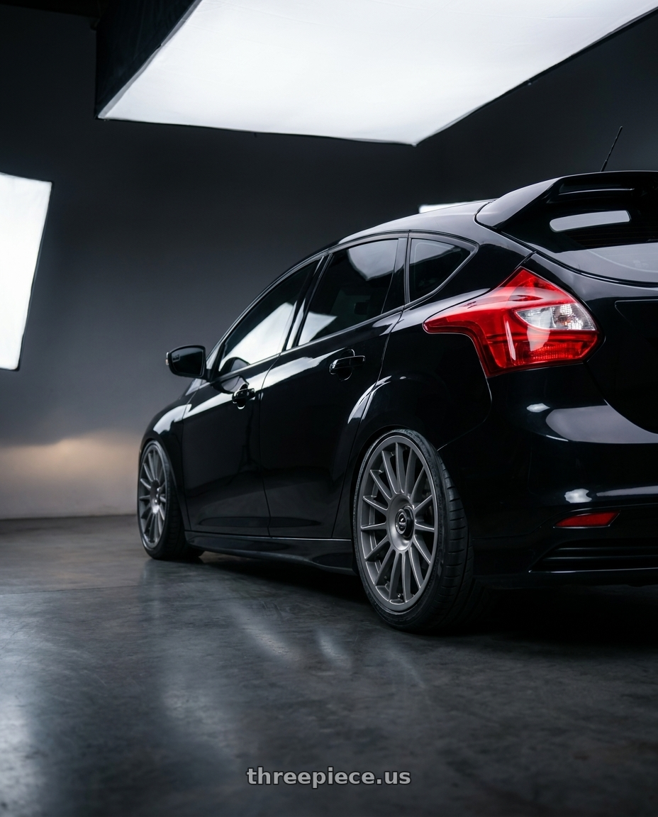 2013 focus st black with fifteen52 PODIUM 5x100 / 5x114.3 17x7.5 +40 FROSTED GRAPHITE (SATIN GREY) wheels rear three quarter view extreme stretch tires
