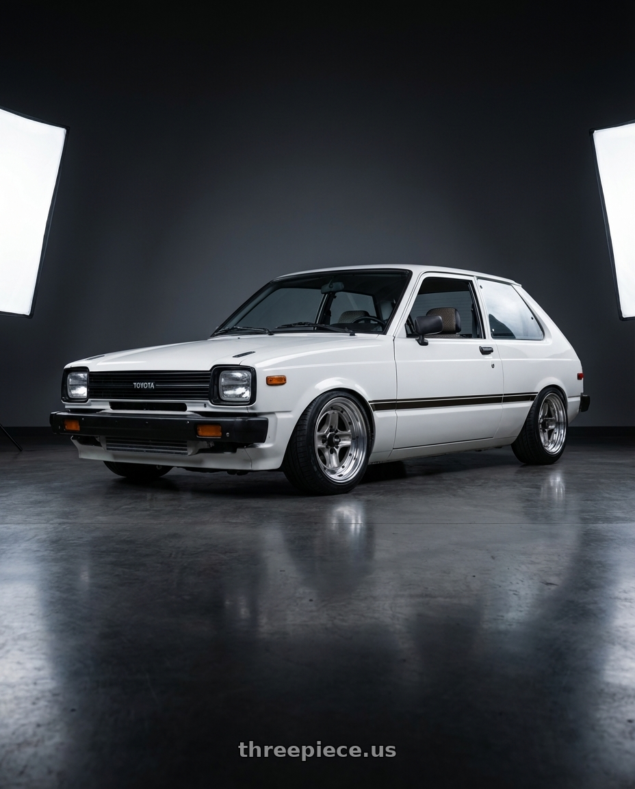 1981 toyota starlet  with Work Equip 40 4x114.3 15x6.5 +16 a disk Brut Silver wheels