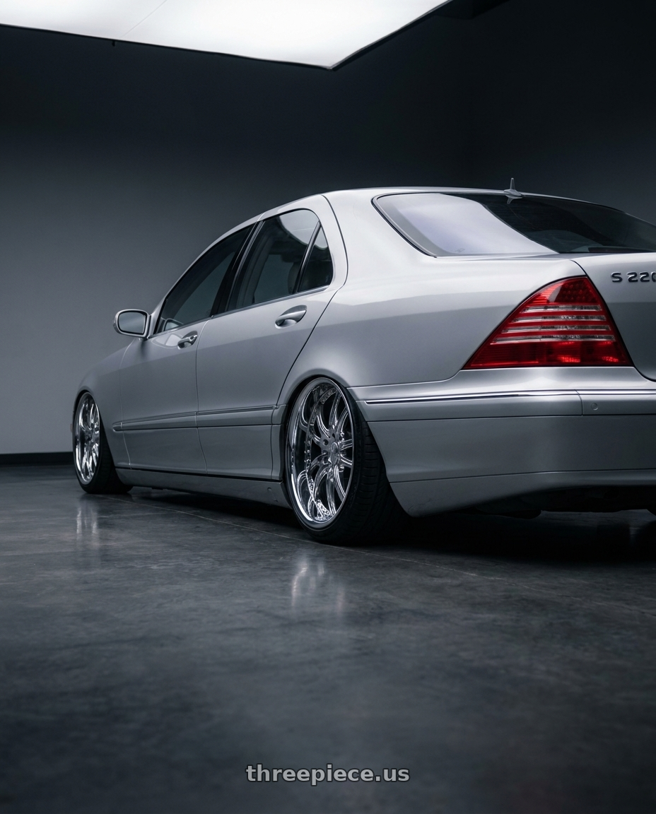 2003 Mercedes S W220 with Cray MANTA 5X120.65 18X9 +50 CHROME wheels rear three quarter view slight stretch tires