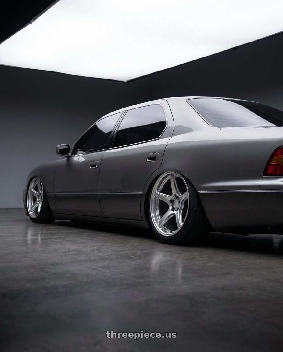 1996 lexus ls400 with Work Emotion T5r 5x114.3 18x10.5 +12 Glow Silver wheels rear three quarter view slight stretch tires