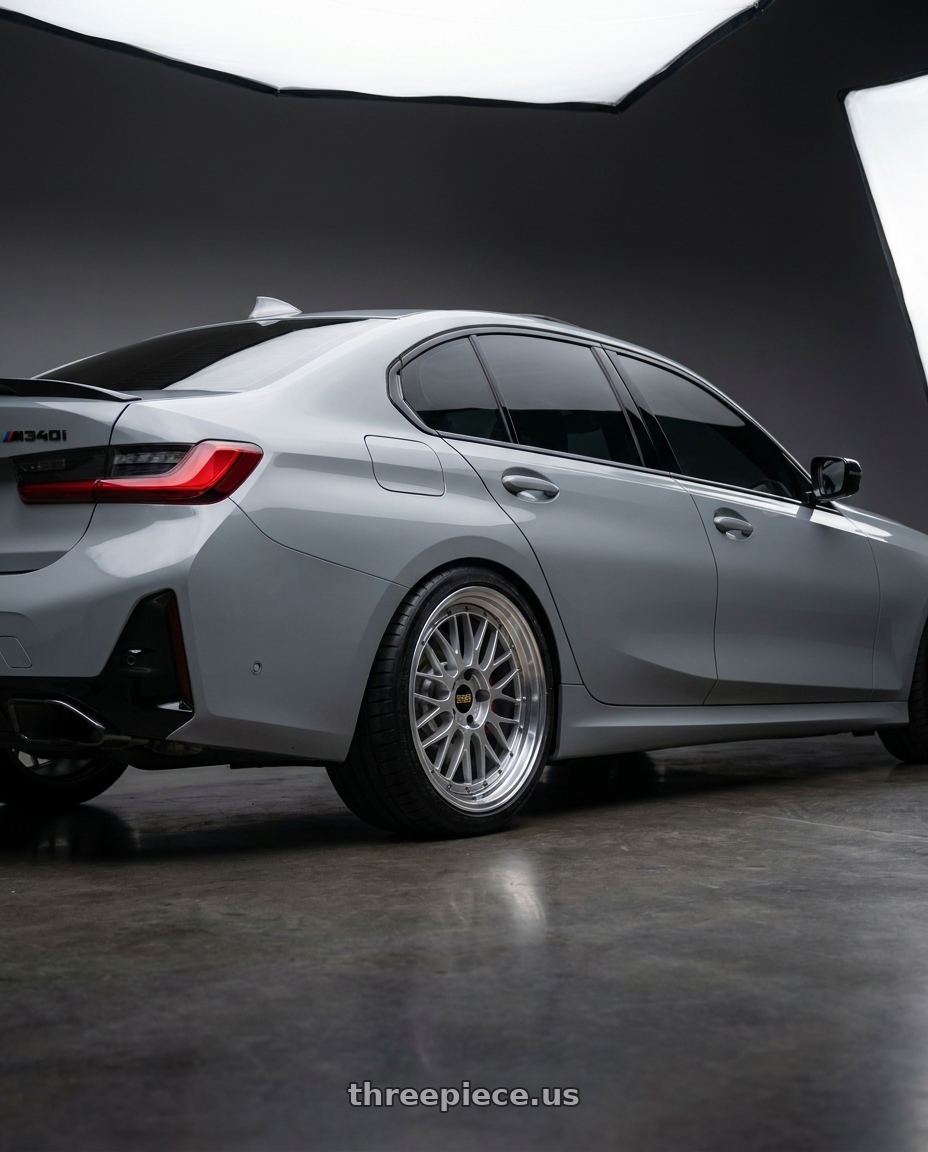 2023 BMW M340i with BBS LM 5x112 19x9.5+38 Diamond Silver wheels rear three quarter view square tires