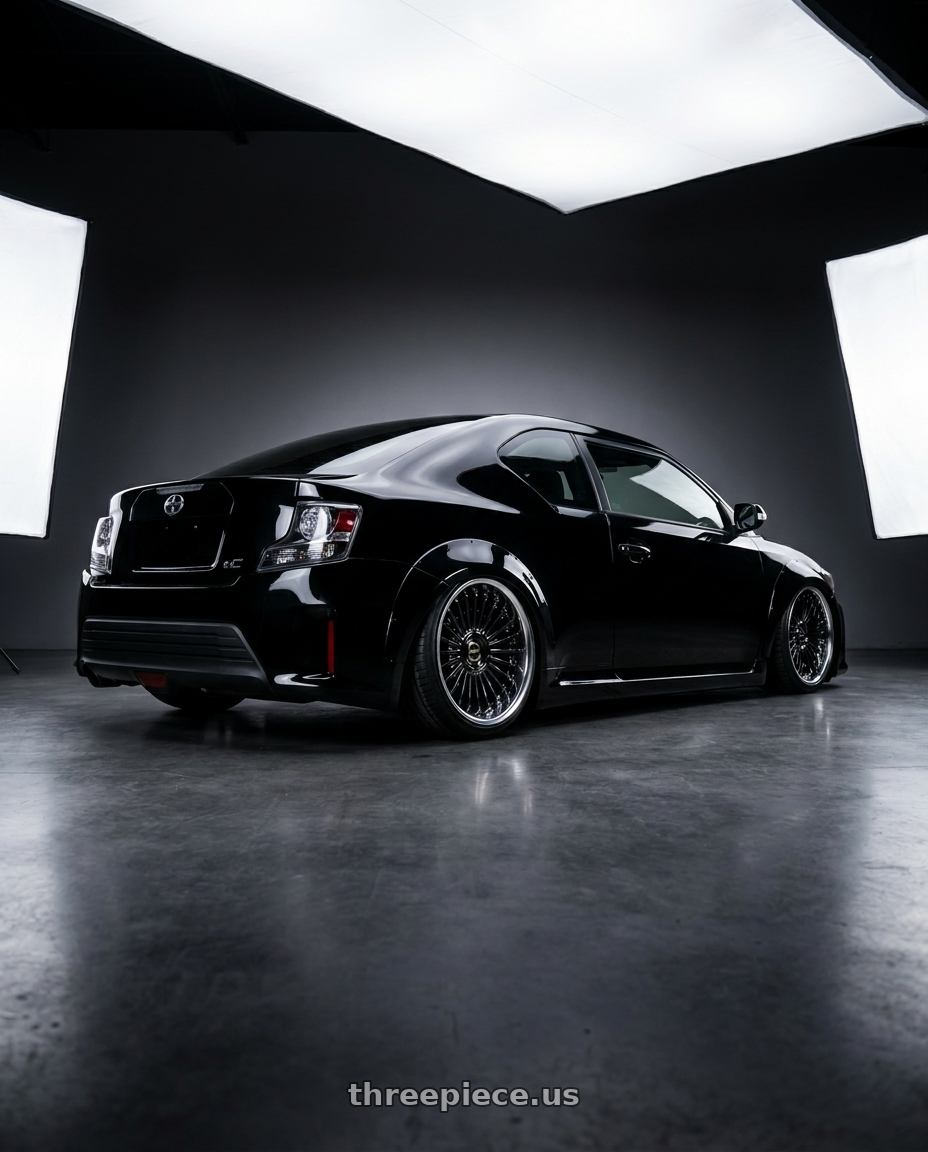 2014 Scion Tc Negro with Work Emitz Black Polish 5x100 19x7.5 +0 wheels rear three quarter view slight stretch tires