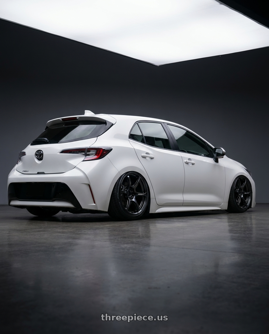 2023 Toyota Corolla Hatchback with Advan RGIII 5x114.3 18x10.5+15 Gloss Black wheels rear three quarter view slight stretch tires