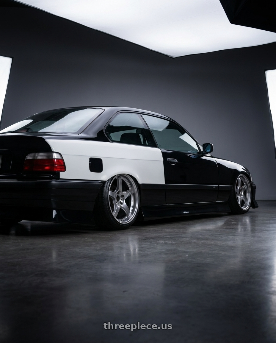 1998 bmw 328is blakc with Gram Lights 57CR 5x114.3 17x9 +38 GRACE SILVER wheels rear three quarter view slight stretch tires