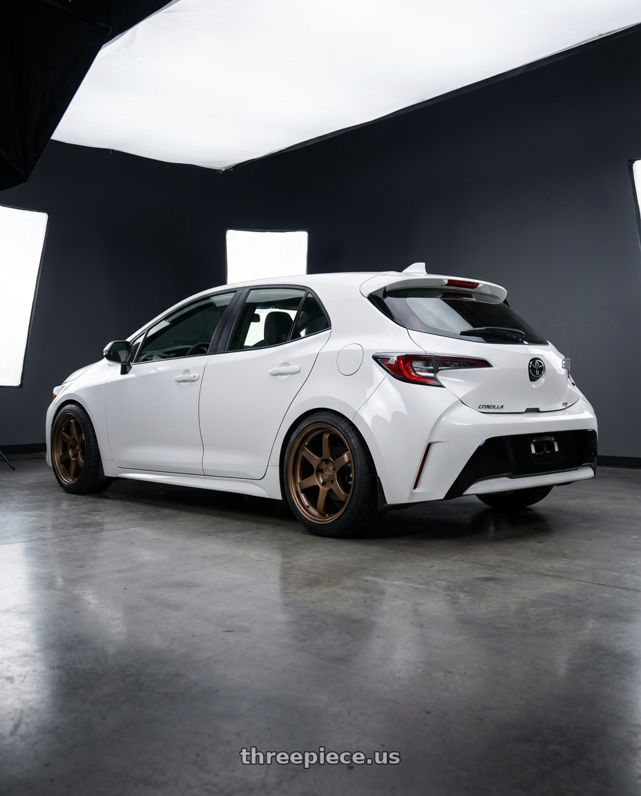 2025 Toyota Corolla Hatchback with Kansei K12B KNP 5X100 17x9 35 Bronze wheels rear three quarter view square tires