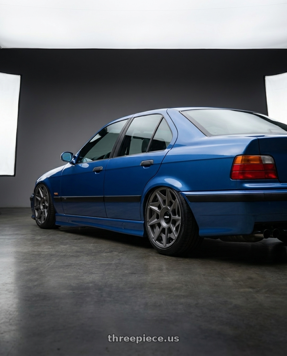 1995 Bmw M3 with Rotiform 1PC R128 CVT 5X100/5X112 19X8.5 +45 MATTE ANTHRACITE wheels rear three quarter view slight stretch tires