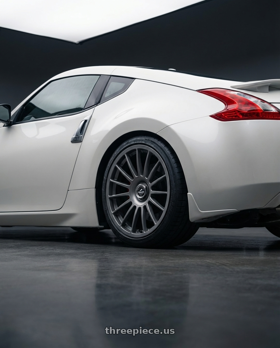 2019 Nissan 370Z with fifteen52 PODIUM 5x114.3 / 5x120 19x8.5 +35 FROSTED GRAPHITE (SATIN GREY) wheels rear three quarter view square tires