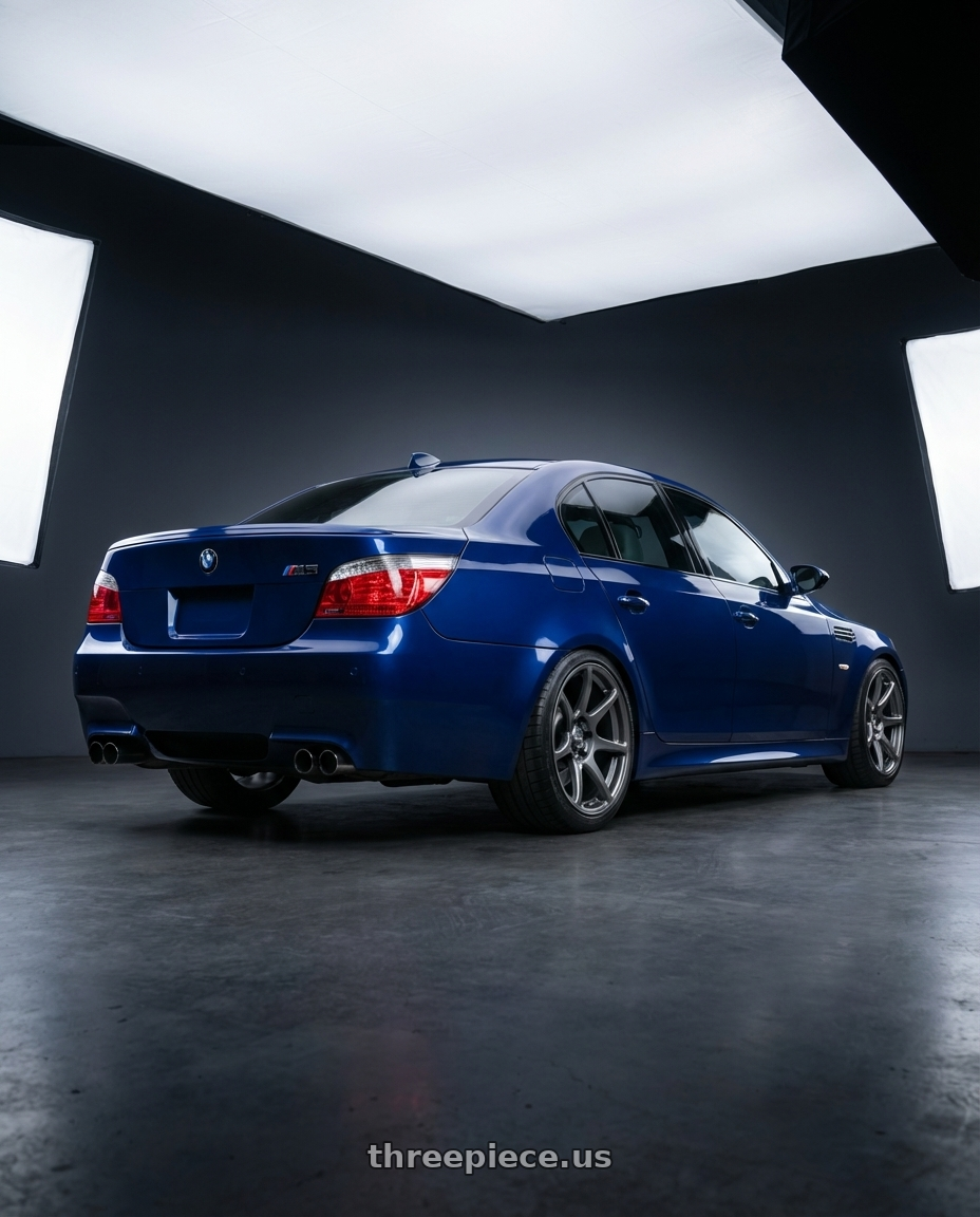 2010 BMW M5 E60 with Kansei K11G Tandem 5X120 19x10.5 22 Gunmetal wheels rear three quarter view square tires