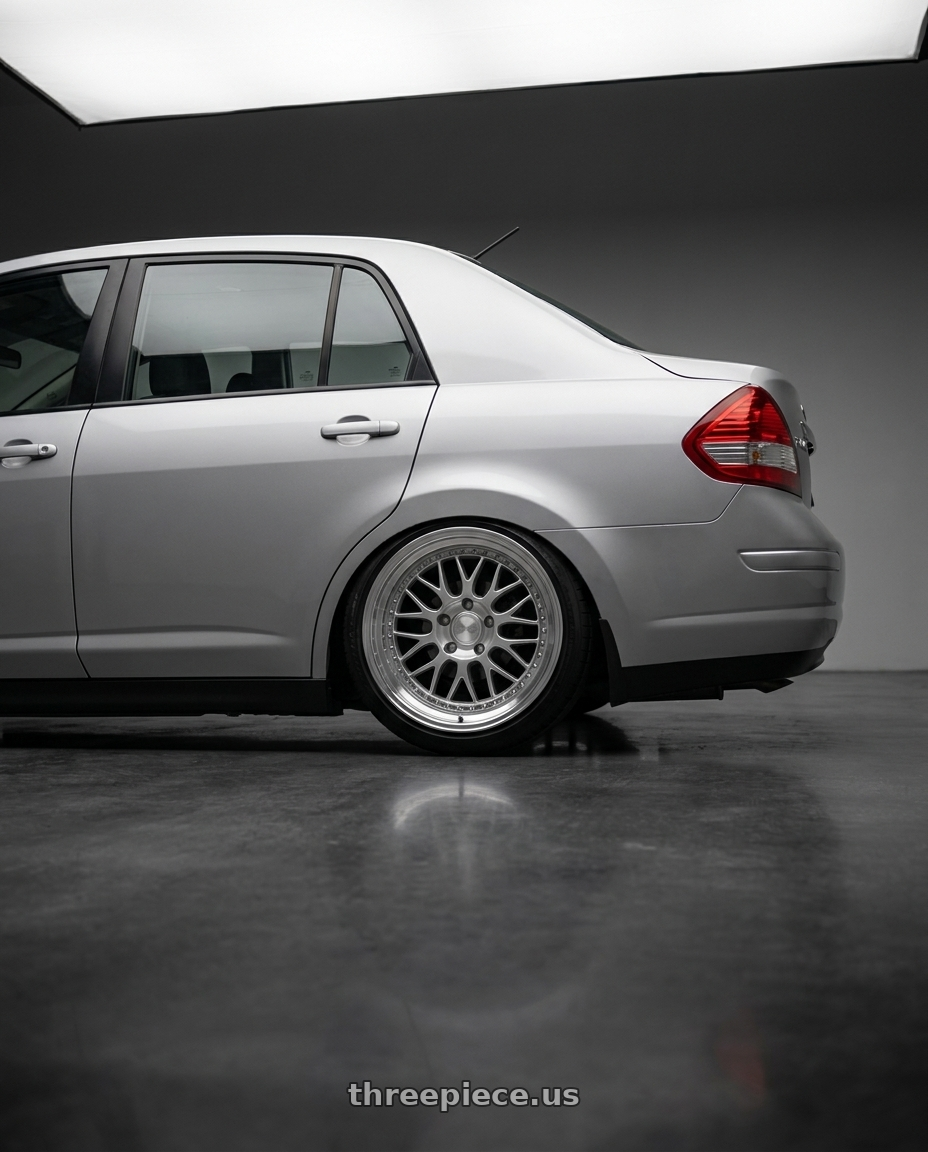 2007 Nissan Tiida with ESR Wheels SR SERIES SR01 5x100 18x8.5 +30 Hyper Silver wheels rear three quarter view square tires