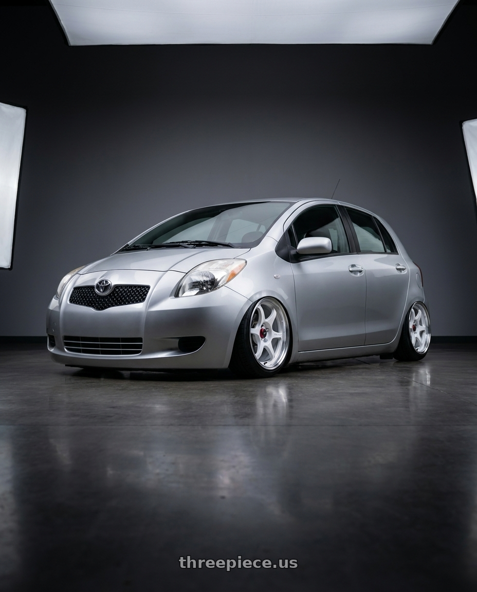 2006 Toyota yaris with Enkei PF06 4x100 15x8+25 White Machined wheels