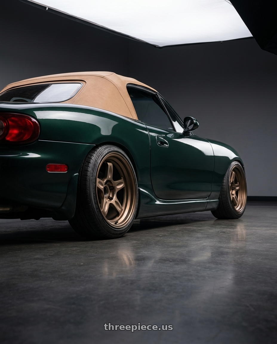 2000 Mazda Miata with Volk Racing 21C 5x112 18x10.5 +30 BRONZE wheels rear three quarter view slight stretch tires