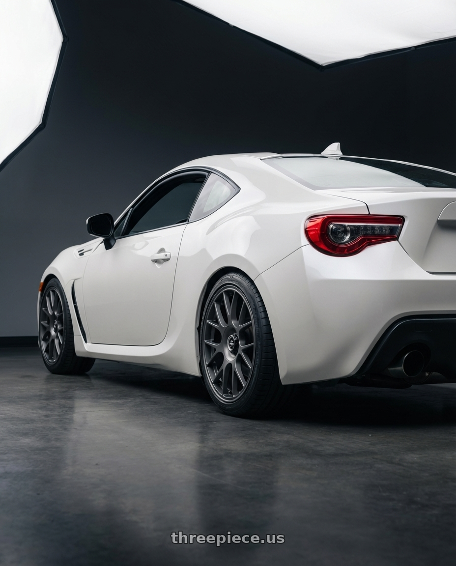 2016 Scion FR-S with fifteen52 APEX 5x100 / 5x112 17x7.5 +35 FROSTED GRAPHITE (SATIN GREY) wheels rear three quarter view square tires