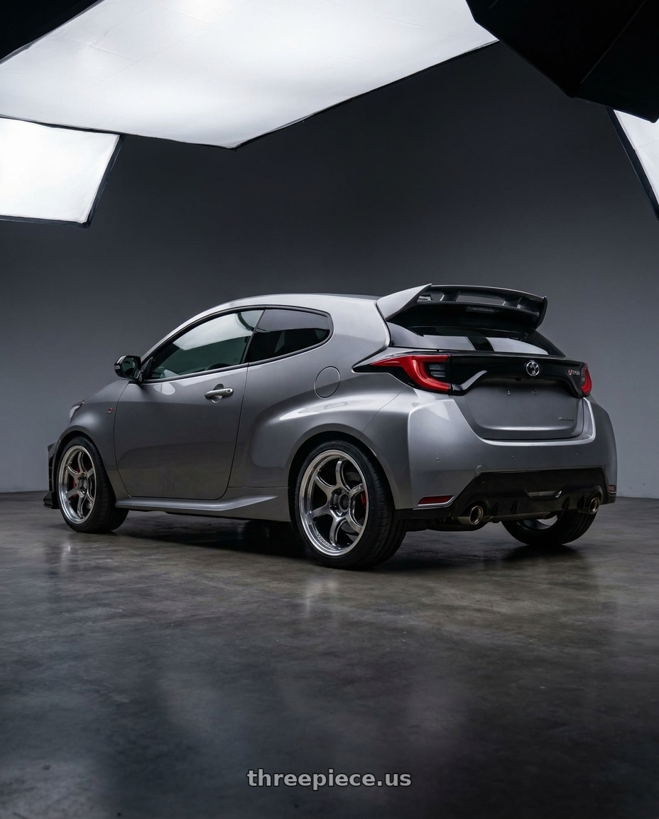2025 toyota gr yaris gen2 with Advan Racing RG-D2 4x100 15x5.0 +45 MACHINING & RACING HYPER BLACK wheels rear three quarter view square tires