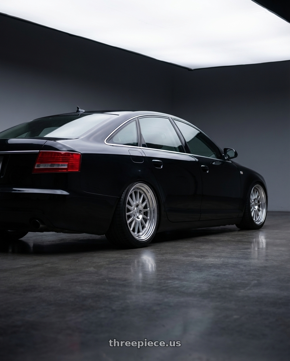 2010 audi a6 with Work Seeker Fx 4x100 16x6.5+30 A Disk Matte Silver Polish wheels rear three quarter view square tires