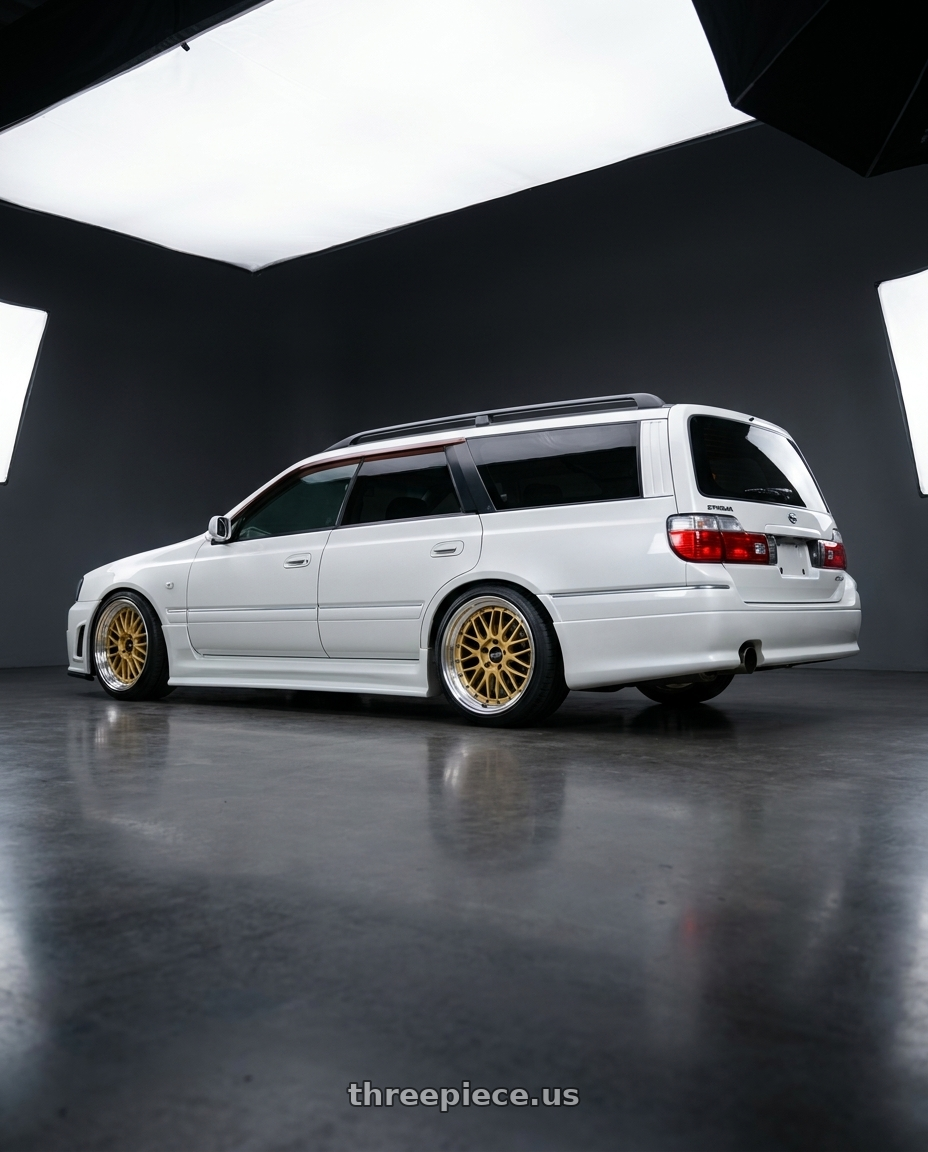 2000 Nissan stagea RSFourS with BBS LM 5x130 18x10.0+50 Gold wheels rear three quarter view square tires