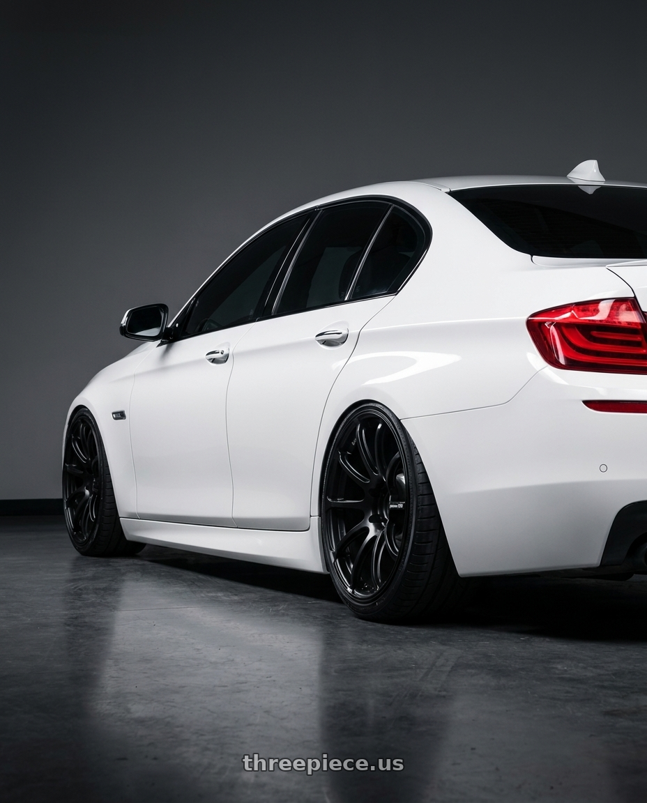 2012 BMW 550i with Advan Racing RSII 5x130 20x11.0 +51 SEMI GLOSS BLACK wheels rear three quarter view extreme stretch tires