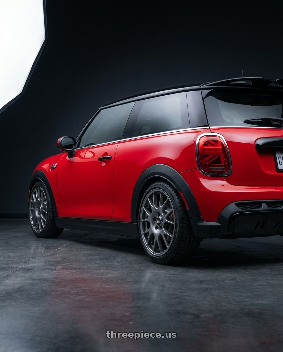 2025 mini jcw red with BBS CO 5x112 18x8 +44 Titanium wheels rear three quarter view square tires