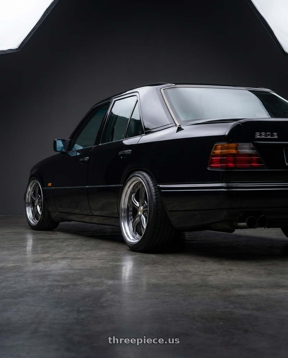 1989 Mercedes 230E W124 Black with Work Wheels VS-KF 5X114.3 19x8.5+34 Brilliant Silver Black A Disk FULL REVERSE wheels rear three quarter view slight stretch tires