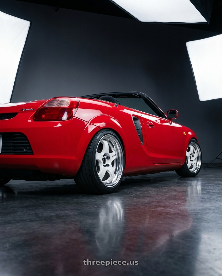 2000 MR2 Spyder in red with Work Meister S1 2P 4x100 15x8+22 O Disk Black wheels rear three quarter view square tires