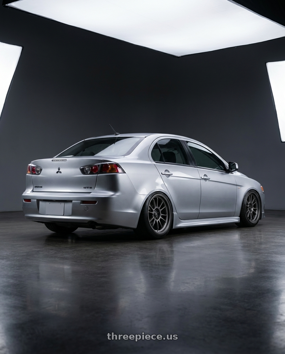 2009 Mitsubishi lancer gts with Konig Hypergram 5x114.3 18x11+40 Matte Grey wheels rear three quarter view slight stretch tires