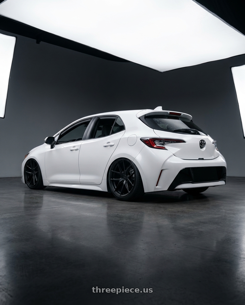 2023 Toyota Corolla Hatchback with Niche 1PC M117 MISANO 5X114.3 18X9.5 +40 MATTE BLACK wheels rear three quarter view slight stretch tires
