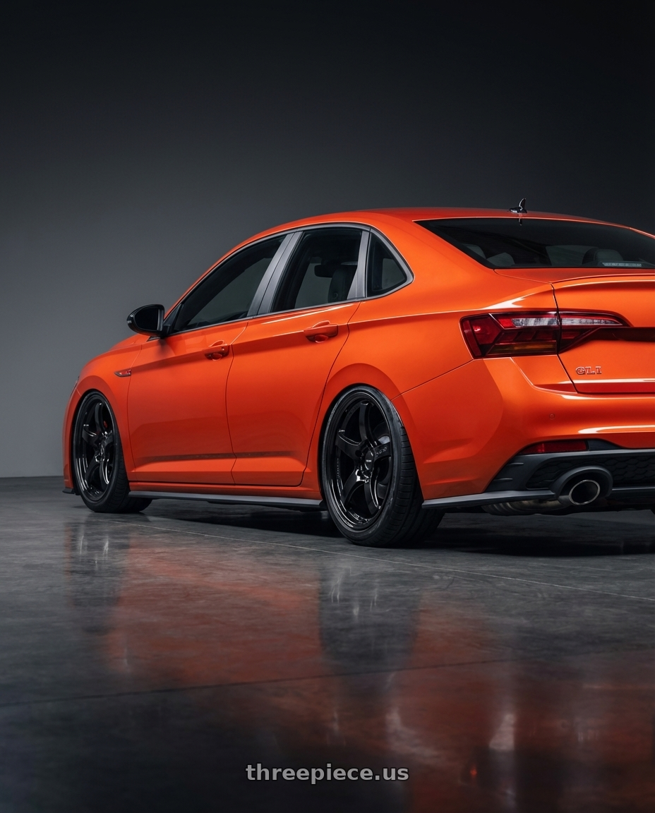 2023 Volkswagen Jetta GLI MK7 with Gram Lights 57CR 5x112 19x9.5+25 Glossy Black wheels rear three quarter view slight stretch tires