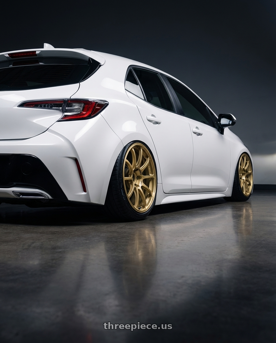 2023 Toyota Corolla Hatchback with Advan RCIII 5x114.3 18x7.5+45 Gold wheels rear three quarter view slight stretch tires