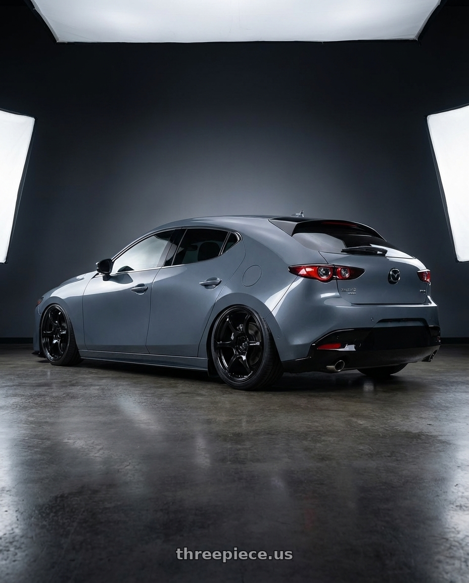 2023 Mazda Mazda3 Turbo with Advan RGIII 5x114.3 18x10.5+15 Gloss Black wheels rear three quarter view slight stretch tires