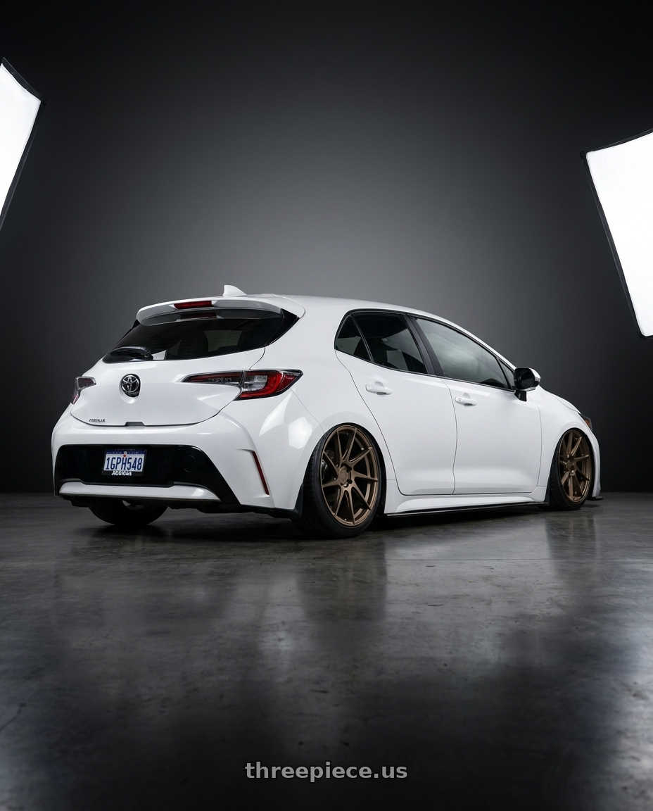 2023 Toyota Corolla Hatchback with Aodhan AH09 5x114.3 18x9.5 +35 Matte Bronze wheels rear three quarter view slight stretch tires