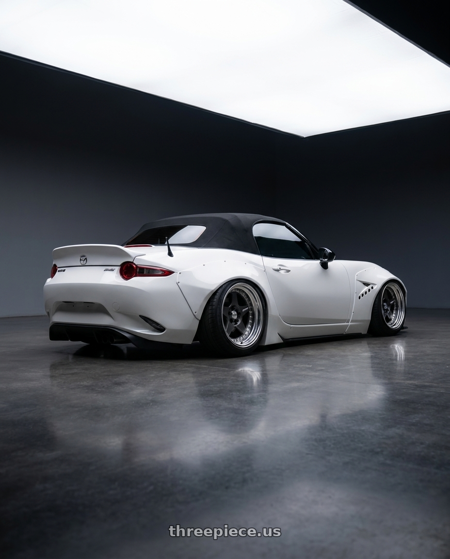 2016 Mazda mx5 with Work Meister Cr01 4x100 16x11+-16 A Disk Matte Gunmetal wheels rear three quarter view slight stretch tires