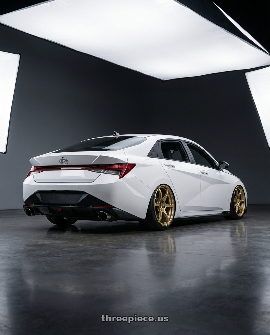 2024 Hyundai Elantra N with Advan RGIII 5x114.3 19x9.5+45 Gold wheels rear three quarter view slight stretch tires