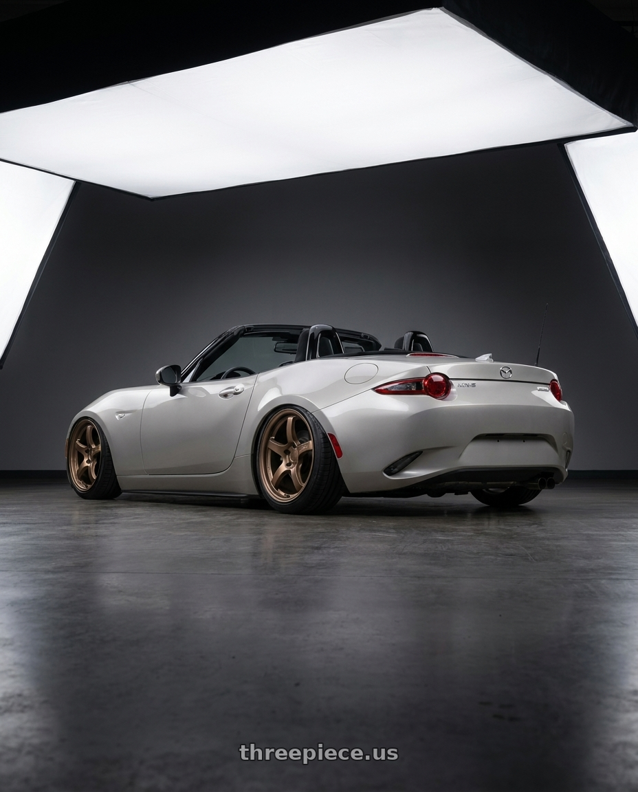 2021 Mazda MX-5 Miata ND with Gram Lights 57CR 5x114.3 17x9+38 Bronze II wheels rear three quarter view slight stretch tires