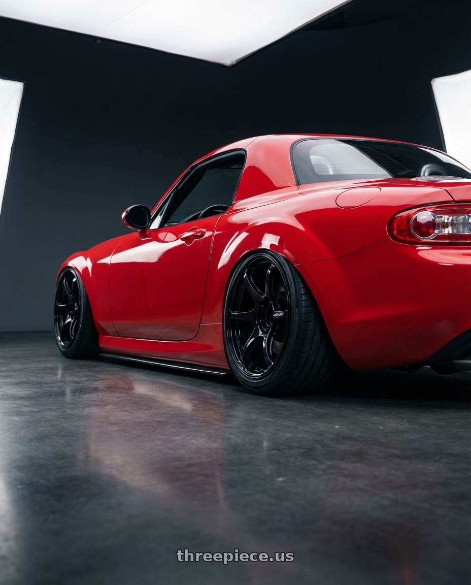 2012 Mazda MX-5 Miata NC with Advan RGIII 5x114.3 17x9.0+45 Gloss Black wheels rear three quarter view slight stretch tires