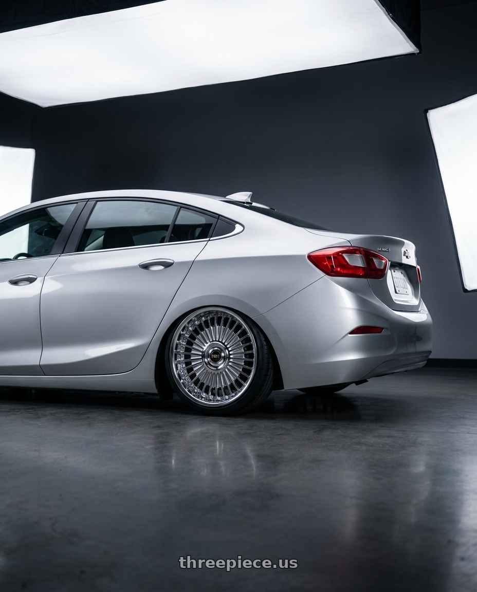 2018 Chevrolet Cruze LT with Work Emitz Chrome 5x105 19x7.5 +38 wheels rear three quarter view slight stretch tires