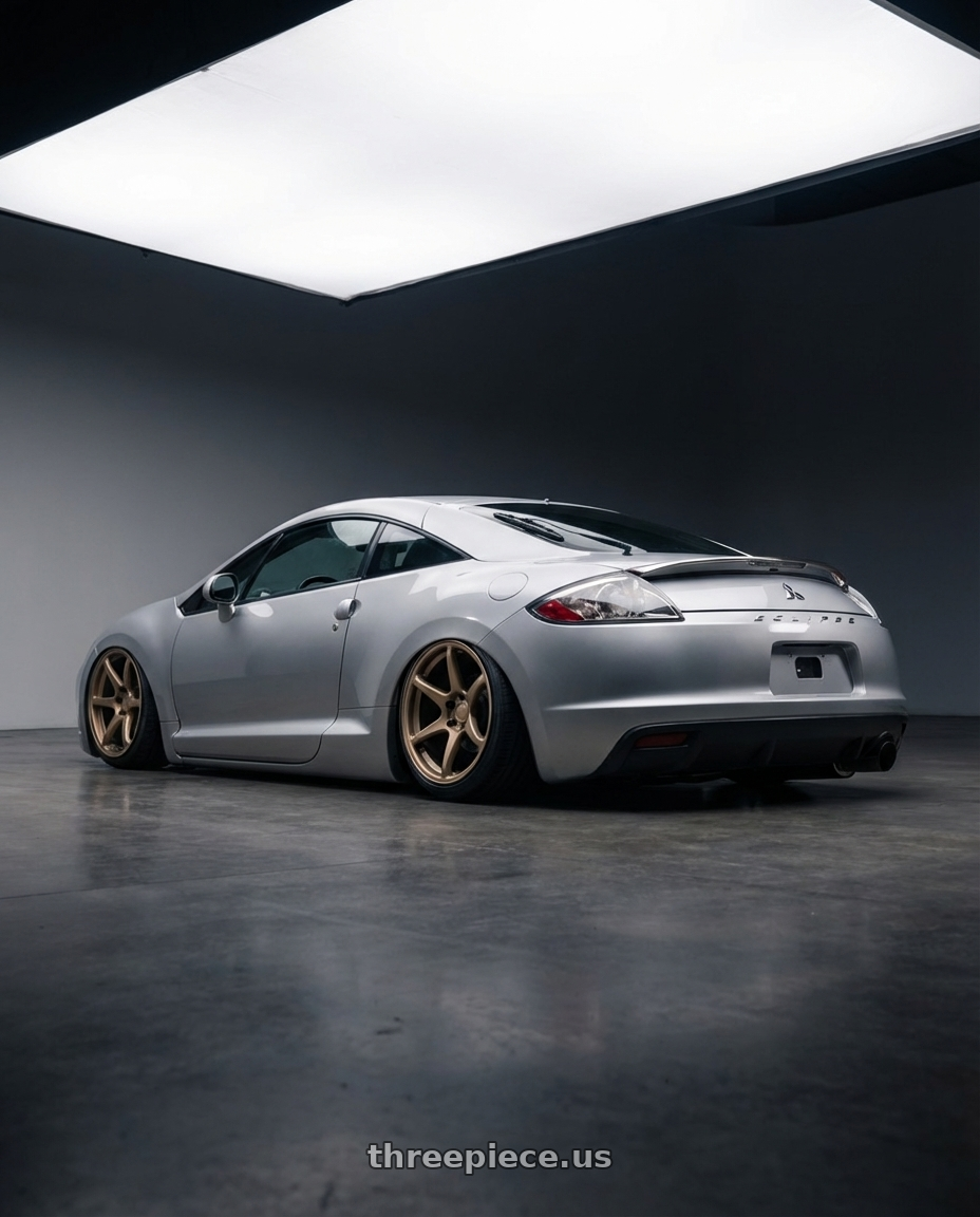 2010 Mitsubishi Eclipse with Kansei K11B Tandem 5x114.3 19x9.5 22 Bronze wheels rear three quarter view slight stretch tires