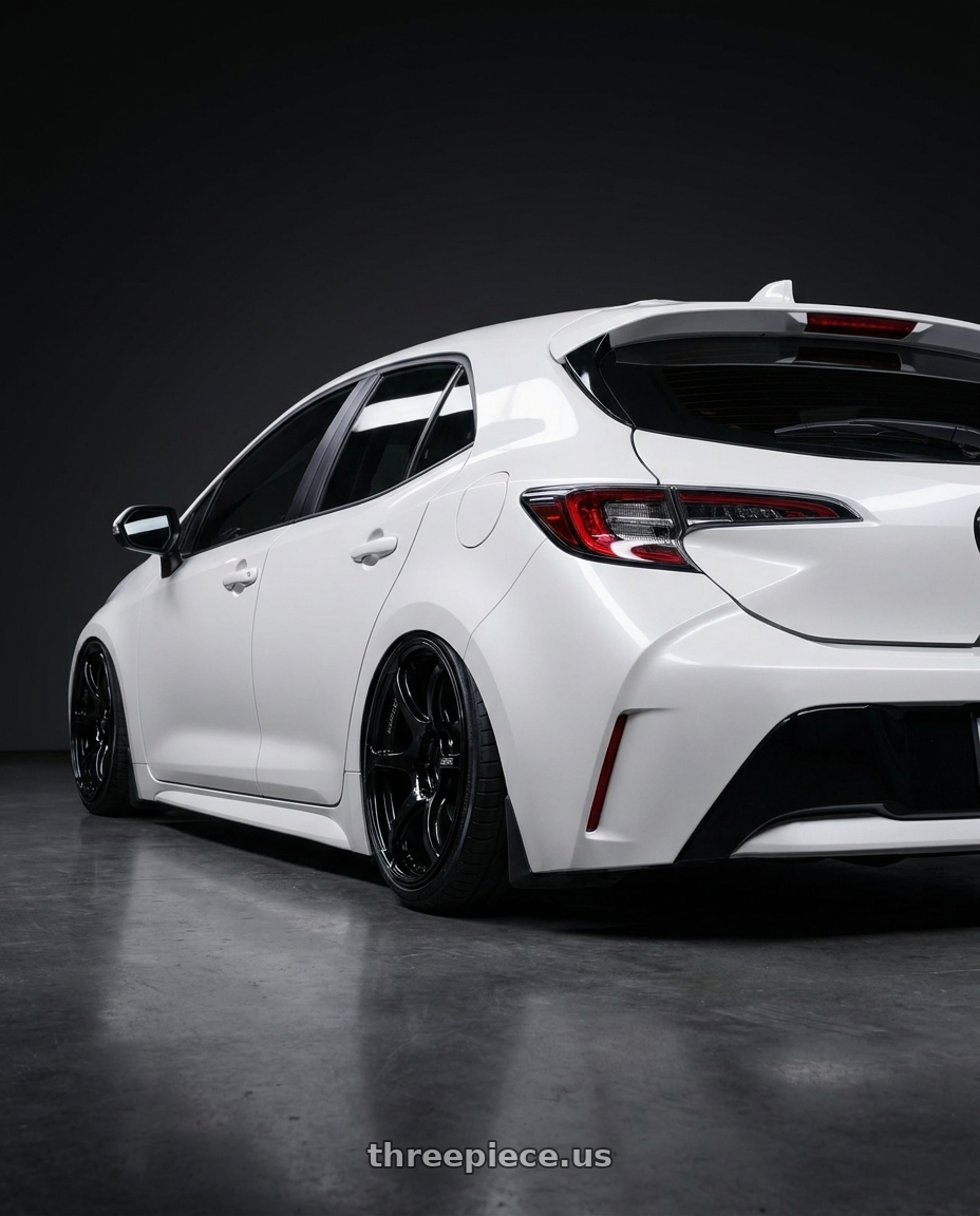2023 Toyota Corolla Hatchback with Advan RGIII 5x114.3 18x10.5+15 Gloss Black wheels rear three quarter view slight stretch tires