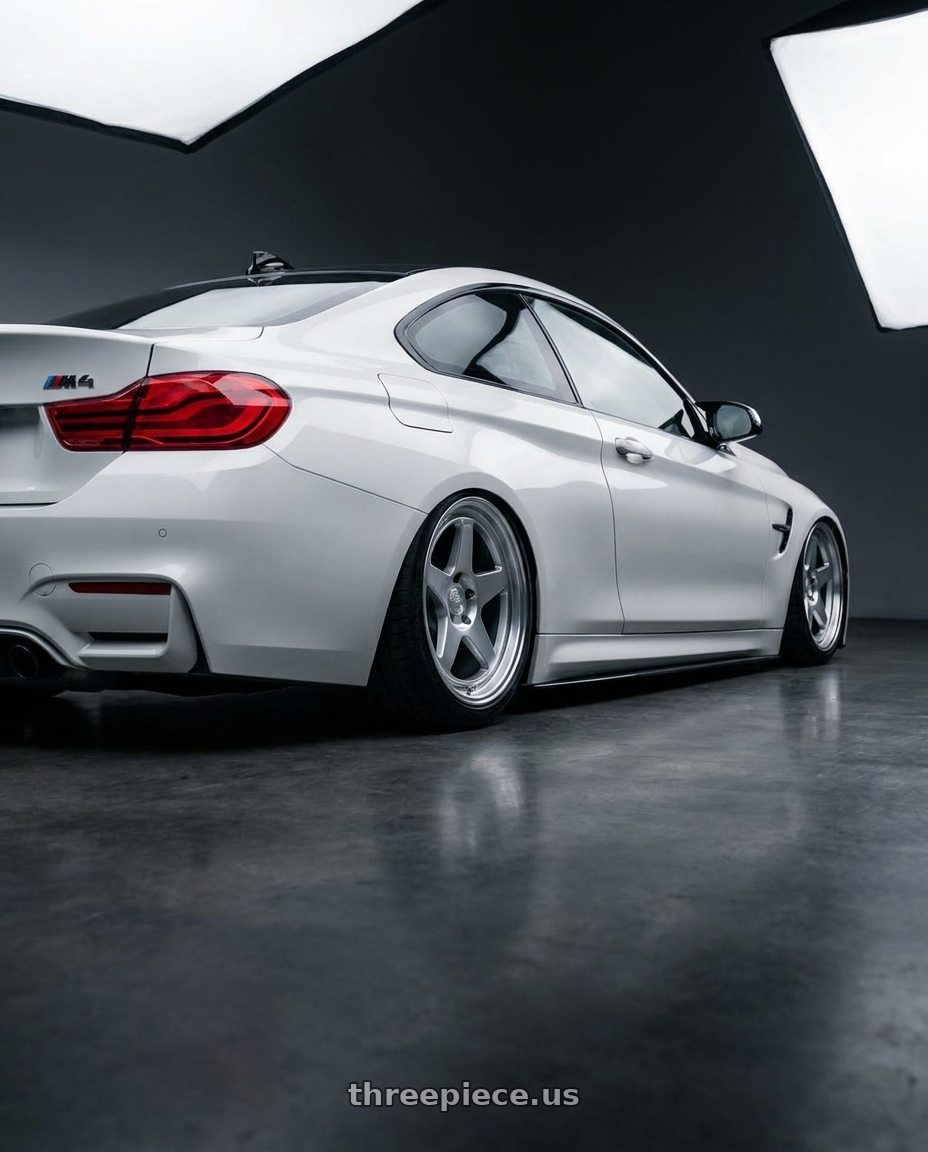 2018 BMW M4 F82 with Kansei K12H KNP 5X120 19x9.5 22 Hyper Silver wheels rear three quarter view slight stretch tires