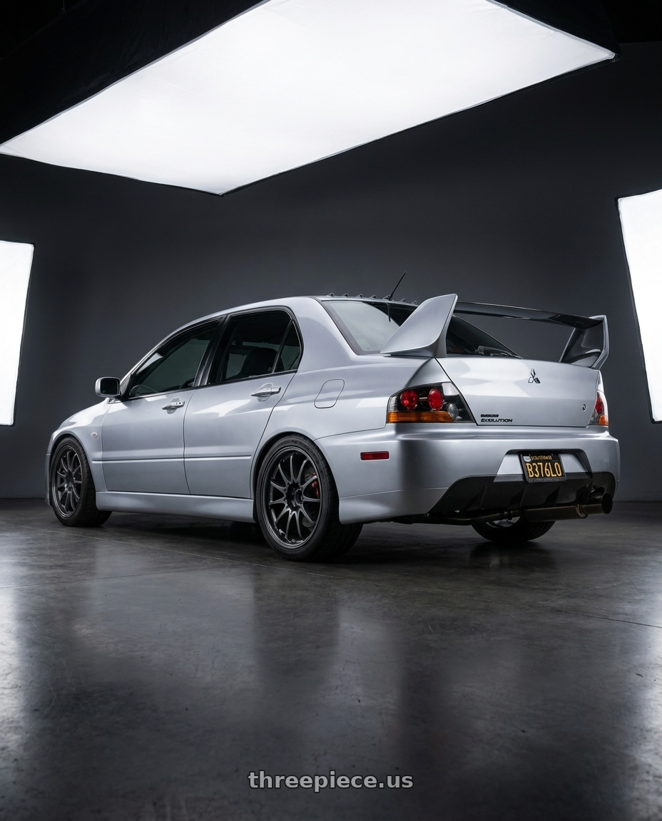2005 Mitsubishi Evolution 8 MR with Volk Racing CE28N-PLUS M-SPEC 5x112 18x9 +38 BLAST GUNMETAL wheels rear three quarter view square tires