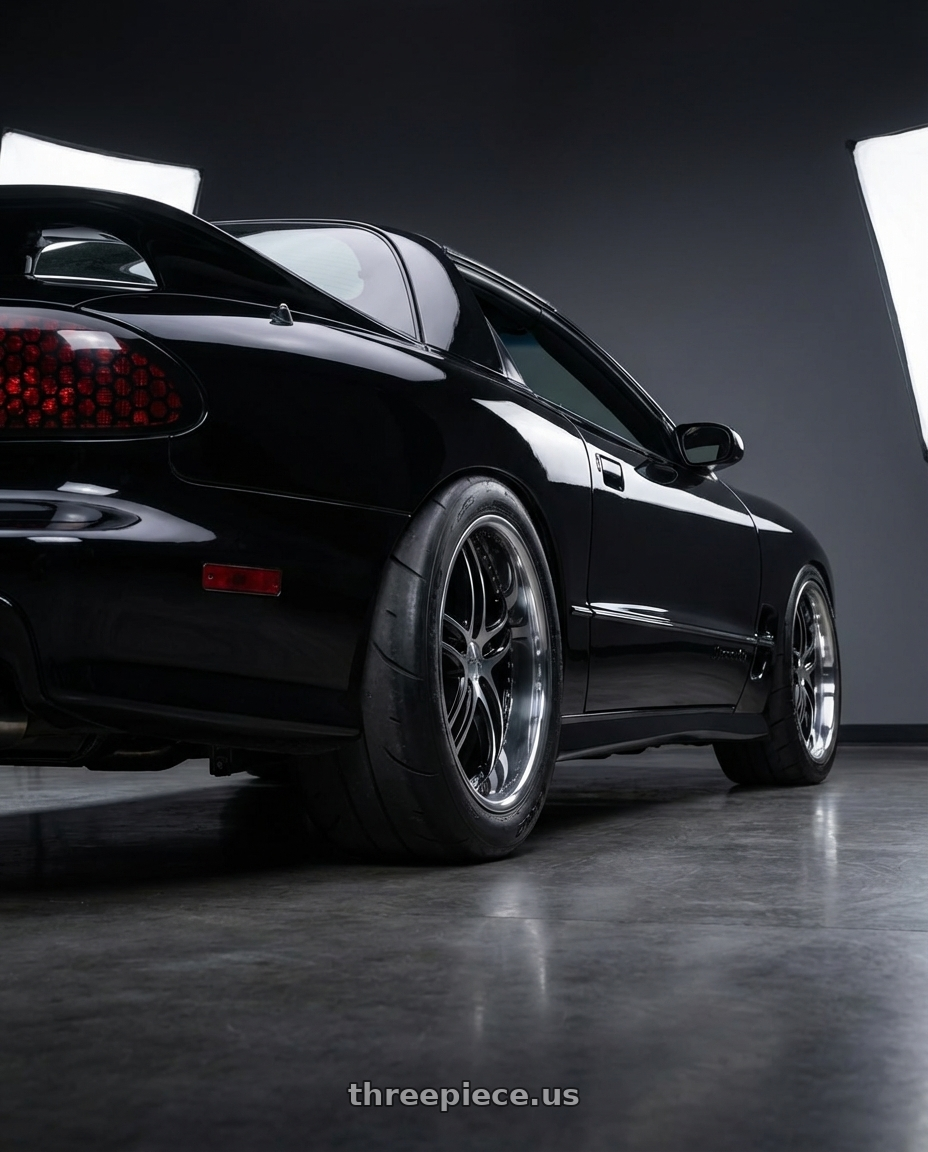 1997 Trans Am  with XIX Wheels XIX 15 5x114.3 20x10 +40 Gloss Black Machined with Stainless Steel Lip wheels rear three quarter view excessive tires