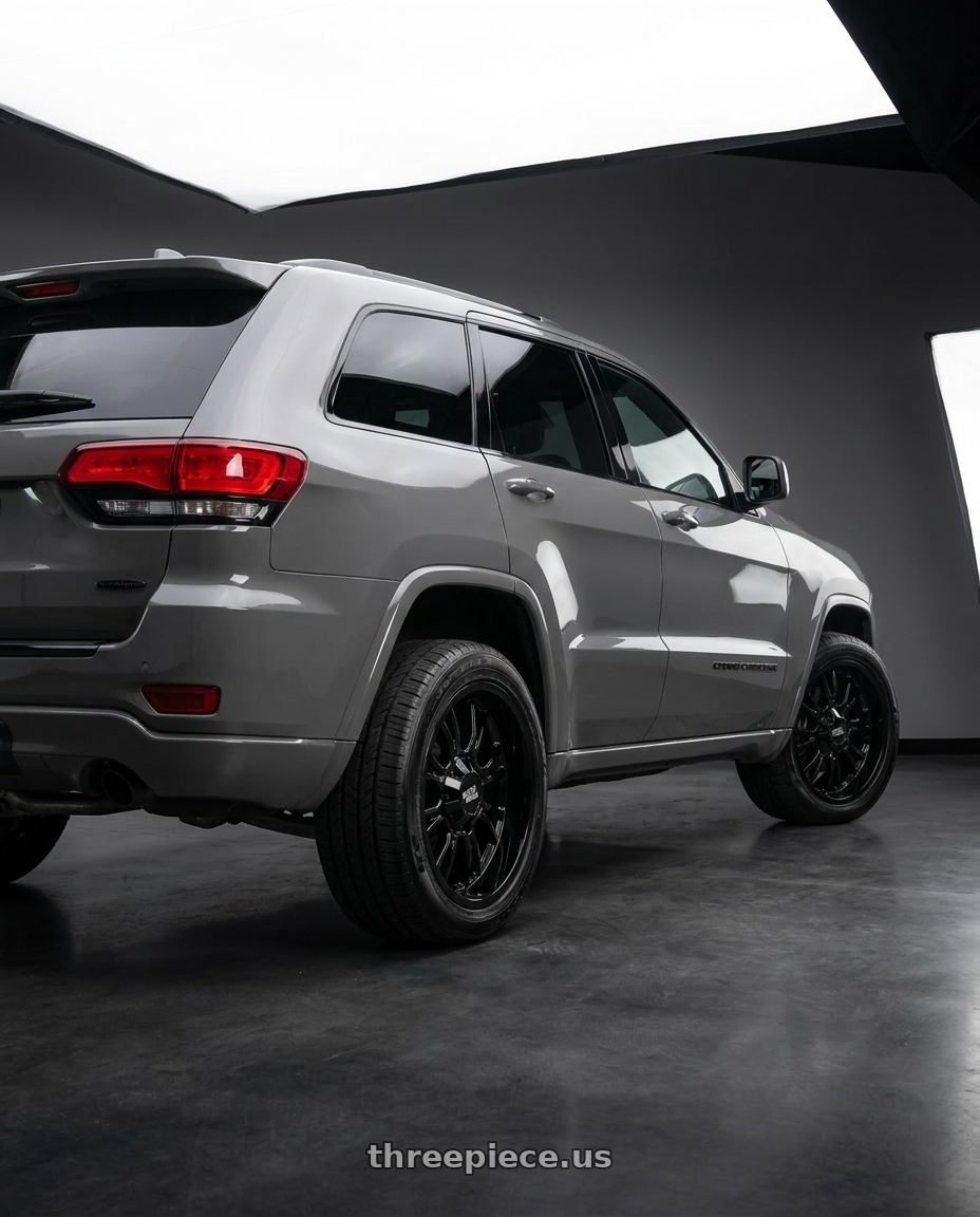 2021 Jeep Grand Cherokee Overland with Moto Metal MO810 LEGACY 5X127/5X139.7 18X9 +20 GLOSS BLACK wheels rear three quarter view square tires