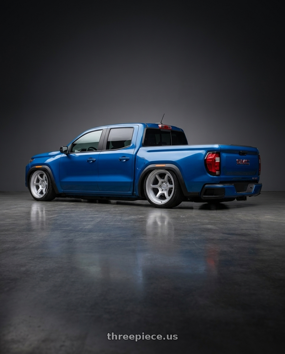 2023 Gmc canyon blue with Black Rhino SHOGUN 6X139.7 17X8.5 -10 HYPER SILVER wheels rear three quarter view slight stretch tires