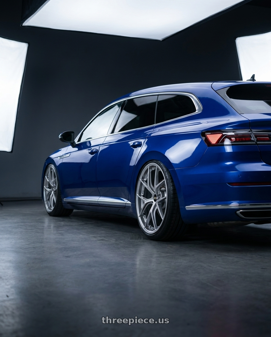 2022 vw Arteon shooting brake Lapiz Blue with BBS RI-S 5x112 20x9.0+34 Diamond Silver wheels rear three quarter view extreme stretch tires