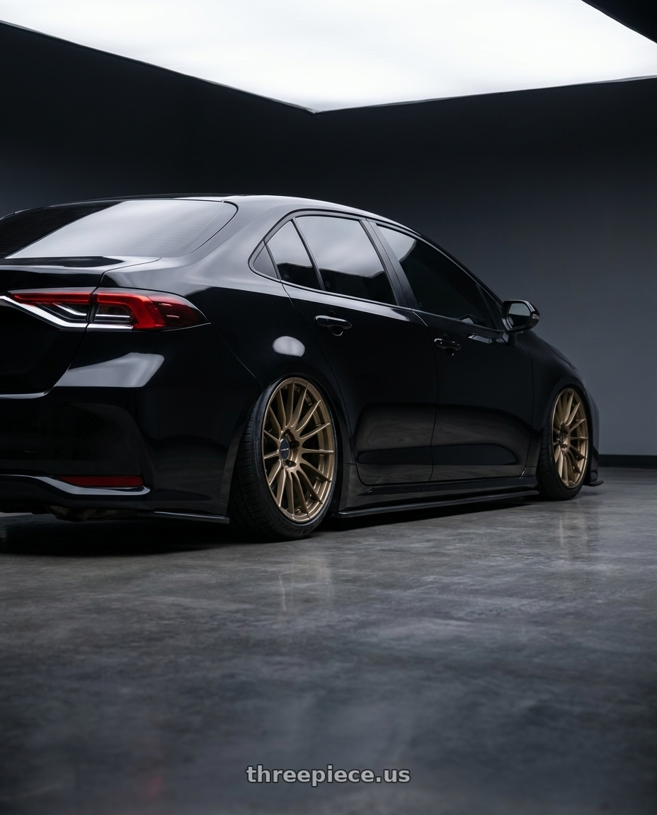 2024 toyota corolla altis with Enkei RS05-RR 5x112 18x9+25 Titanium Gold wheels rear three quarter view slight stretch tires