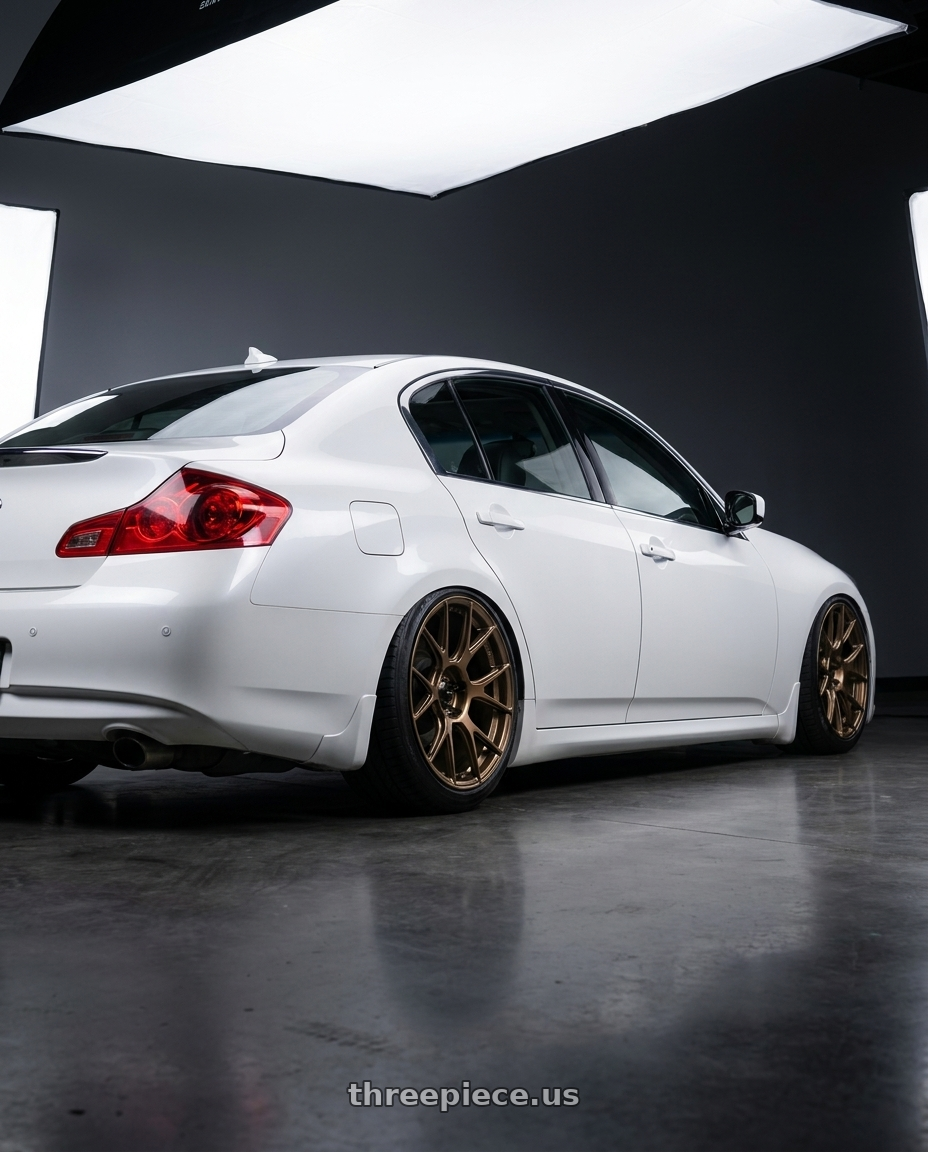 2012 Infiniti G37 with Konig Ampliform 5x114.3 19x10.5+23 Gloss Bronze wheels rear three quarter view slight stretch tires