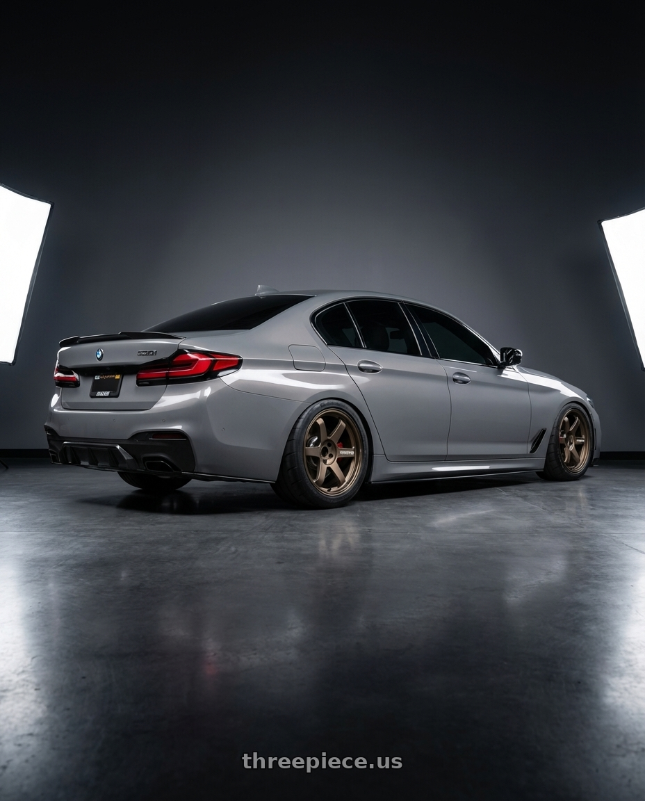 2022 bmw 530i with Volk Racing TE37 Ultra M Spec 5x112 19x9.5+23 19x10.5+35 Bronze Almite Toyota Supra MK5 Spec wheels rear three quarter view meaty tires